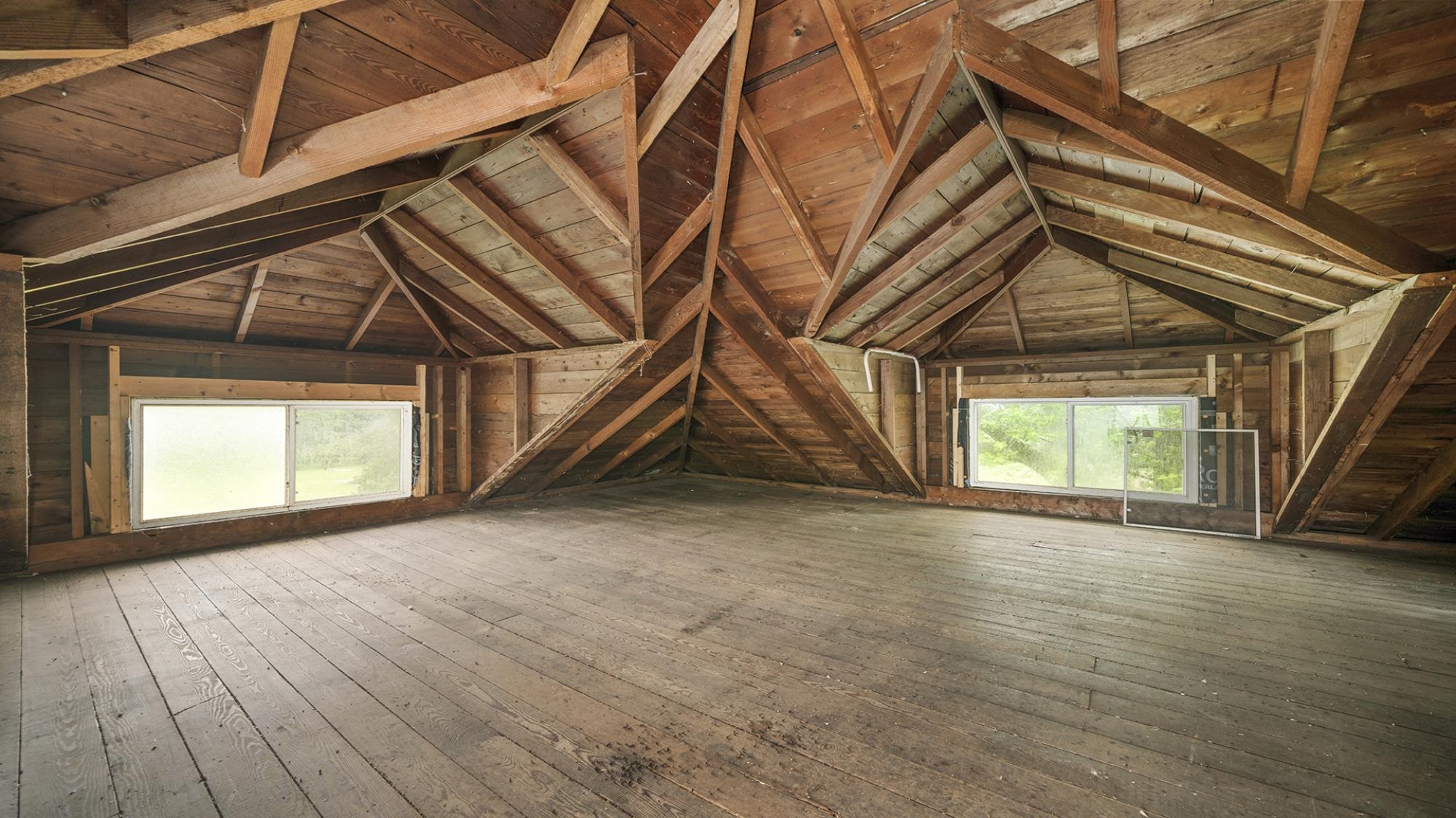 4407 East River Road Ridott, IL 61067 - Photo 8 of 45 an empty room with wooden floor and windows