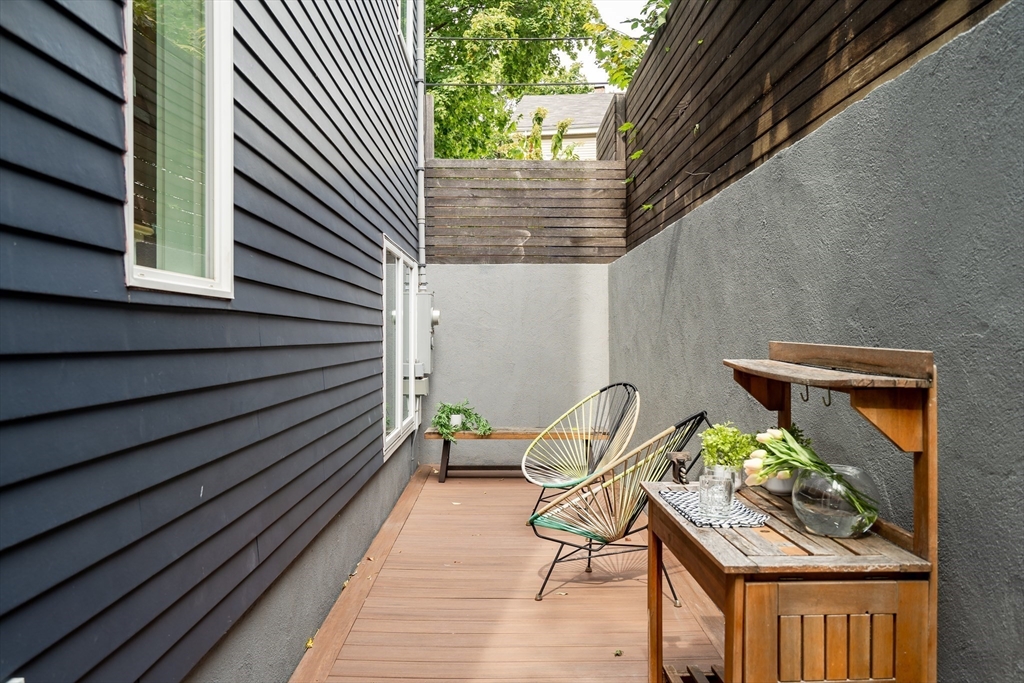 86 School Street Cambridge, MA 02139 - Photo 11 of 35 a balcony with table and chairs