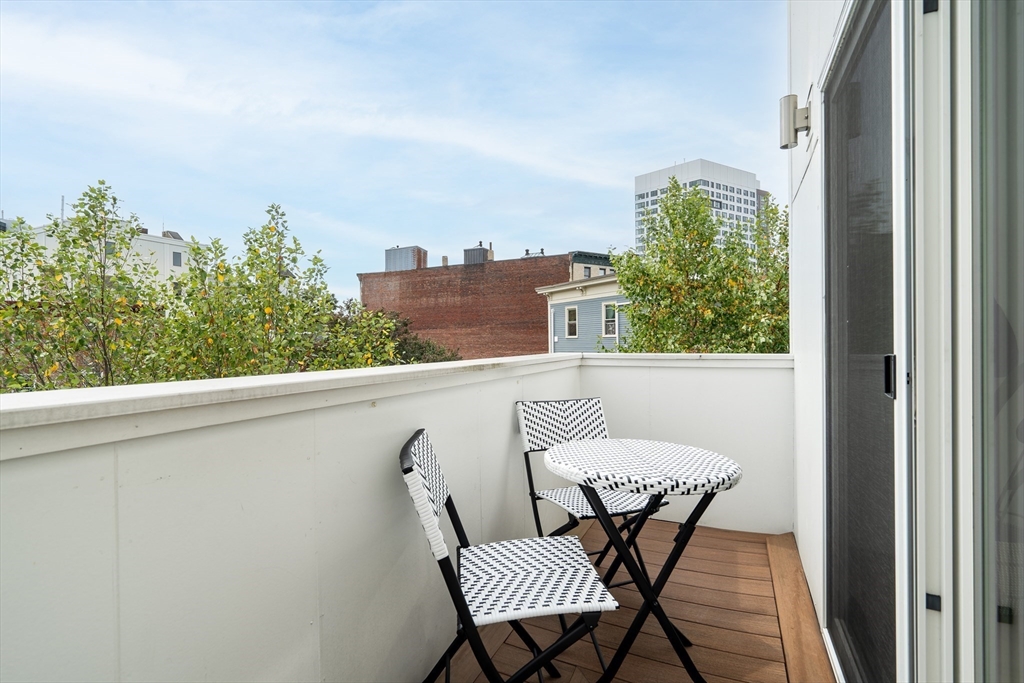 86 School Street Cambridge, MA 02139 - Photo 15 of 35 a balcony view with a couple of chairs