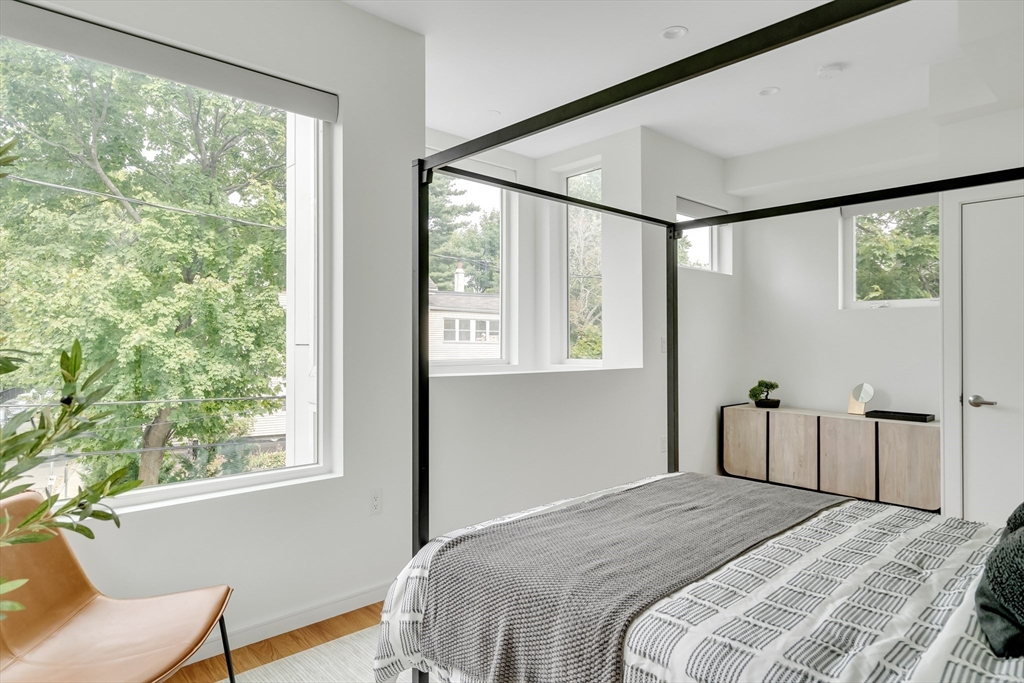 86 School Street Cambridge, MA 02139 - Photo 19 of 35 a bedroom with a bed and a window