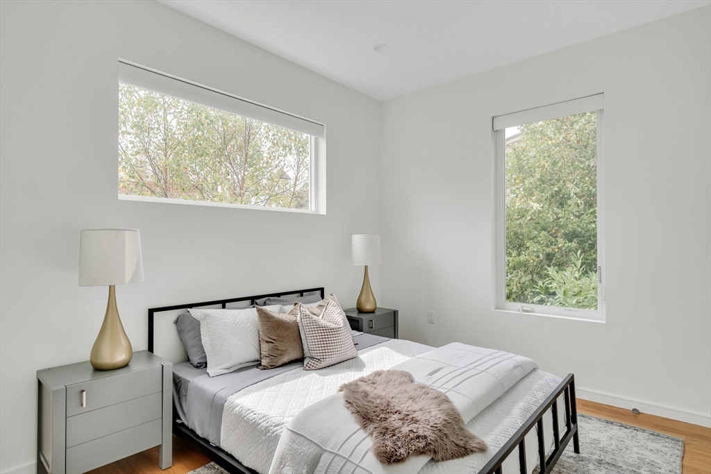 86 School Street Cambridge, MA 02139 - Photo 22 of 35 a bedroom with a bed and a window