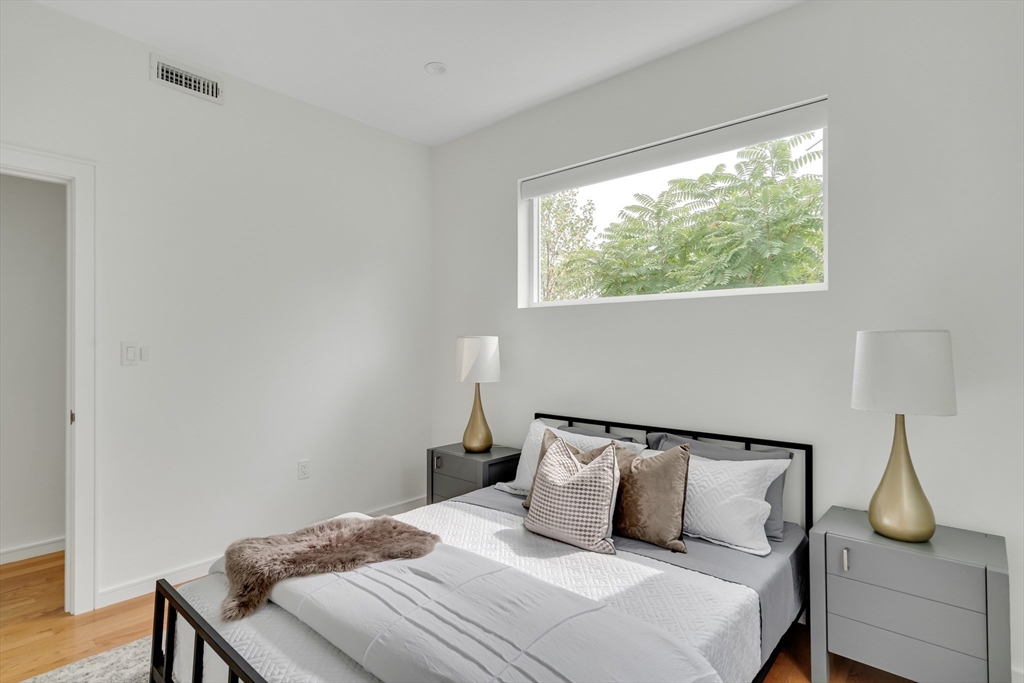 86 School Street Cambridge, MA 02139 - Photo 23 of 35 a bedroom with a bed and window