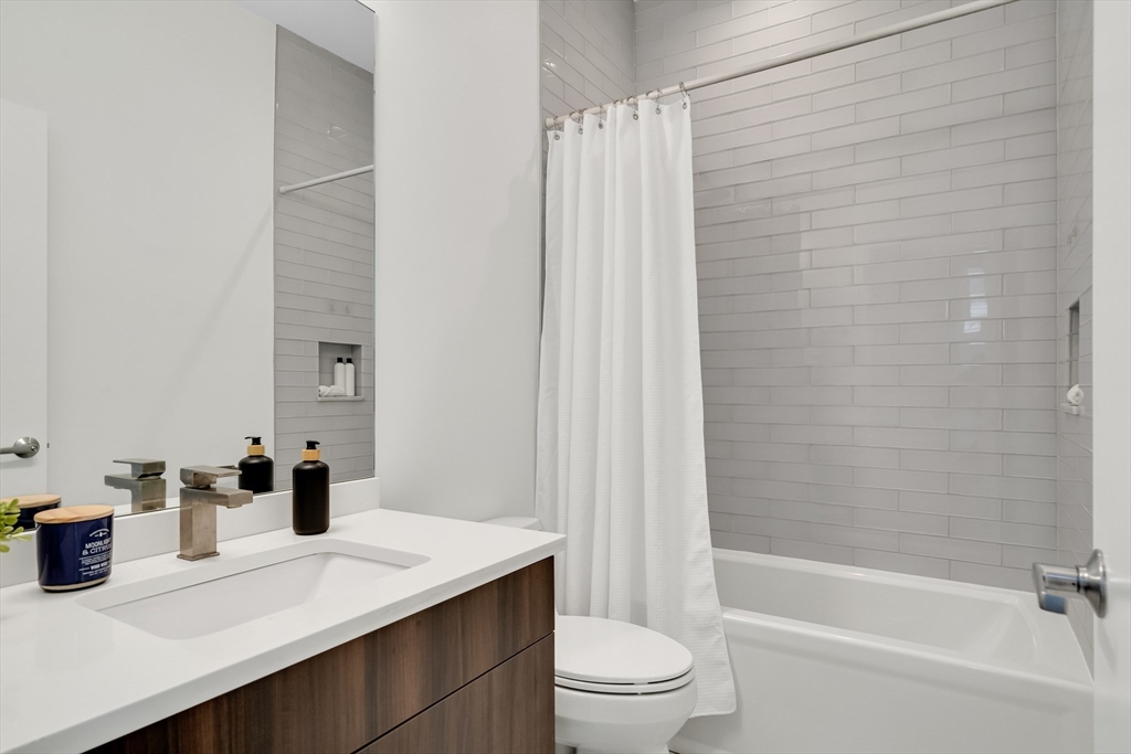 86 School Street Cambridge, MA 02139 - Photo 24 of 35 a bathroom with a sink a toilet and shower