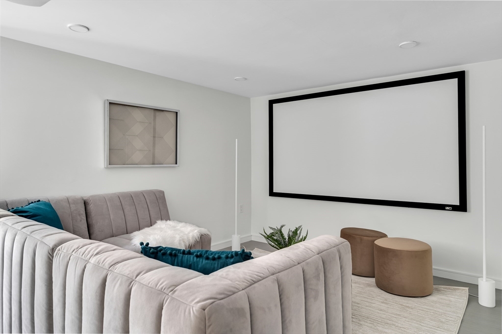 86 School Street Cambridge, MA 02139 - Photo 29 of 35 a bedroom with furniture and a flat screen tv