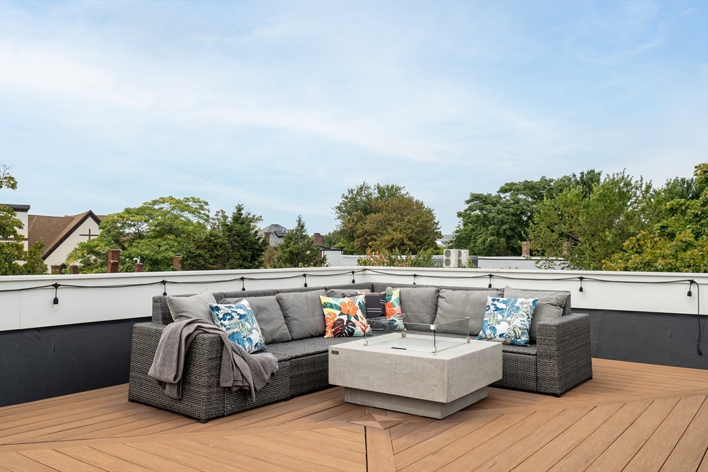 86 School Street Cambridge, MA 02139 - Photo 30 of 35 a view of roof deck with couches and sky view
