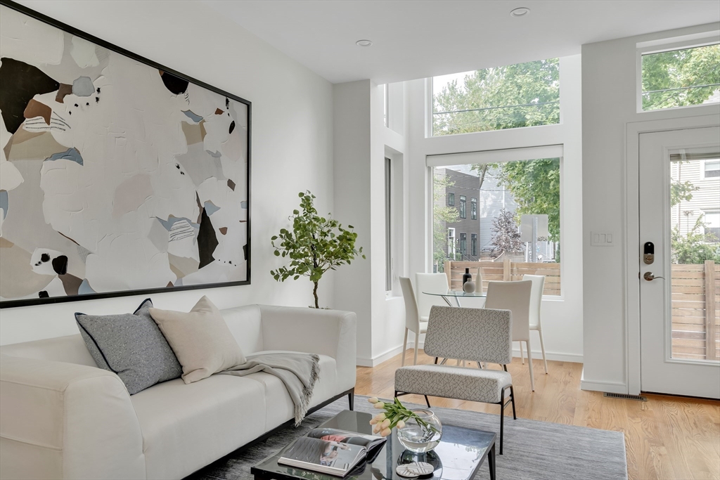 86 School Street Cambridge, MA 02139 - Photo 4 of 35 a living room with furniture and a large window