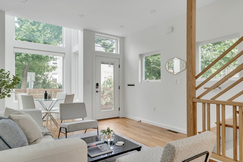 86 School Street Cambridge, MA 02139 - Photo 5 of 35 a living room with furniture and a large window