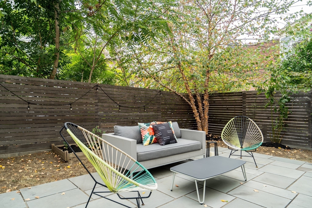 86 School Street Cambridge, MA 02139 - Photo 8 of 35 a patio with glass top table and chairs