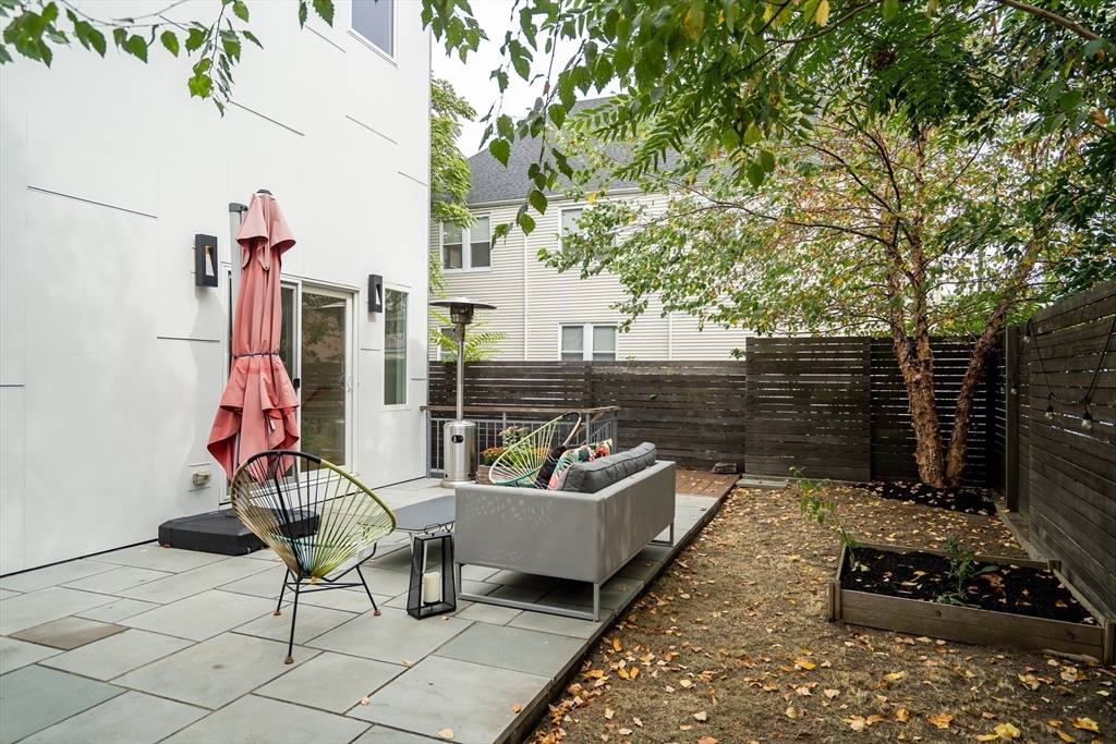 86 School Street Cambridge, MA 02139 - Photo 9 of 35 a view of a patio with a table and chairs