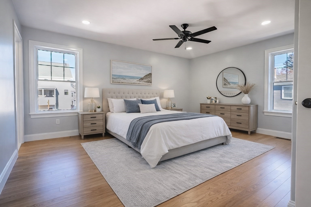 126 Wheeler Street Fall River, MA 02724 - Photo 11 of 32 a bedroom with a large bed and a large window
