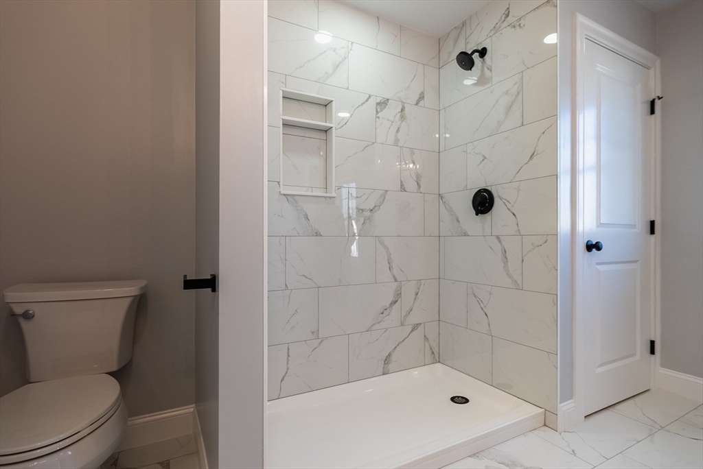 126 Wheeler Street Fall River, MA 02724 - Photo 16 of 32 a bathroom with a shower a toilet and a sink