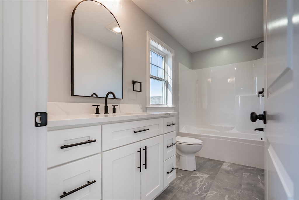 126 Wheeler Street Fall River, MA 02724 - Photo 16 of 29 a bathroom with a double vanity sink toilet and a mirror