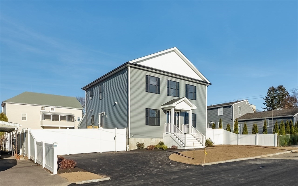126 Wheeler Street Fall River, MA 02724 - Photo 2 of 32 a front view of a house with a yard