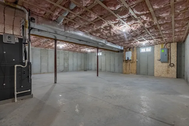 a view of a hallway with wooden walls