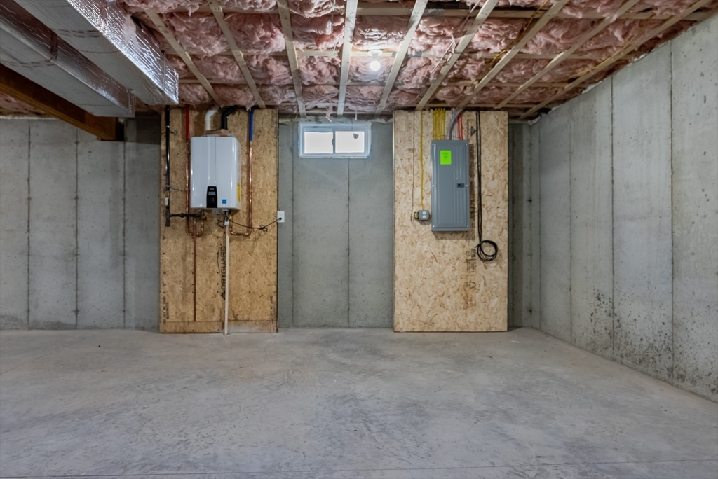 126 Wheeler Street Fall River, MA 02724 - Photo 22 of 29 a view of a hallway with wooden walls