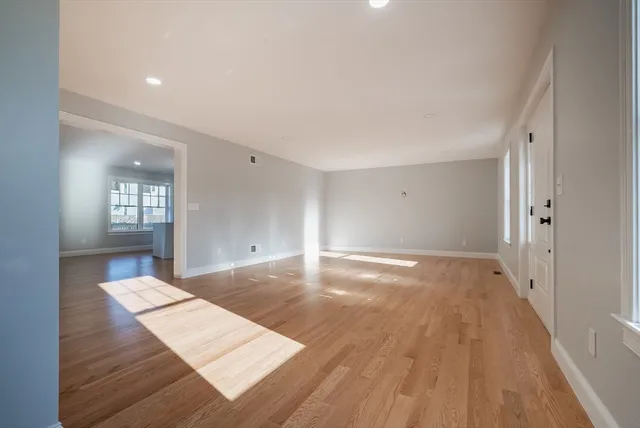 wooden floor in a hall with an entryway