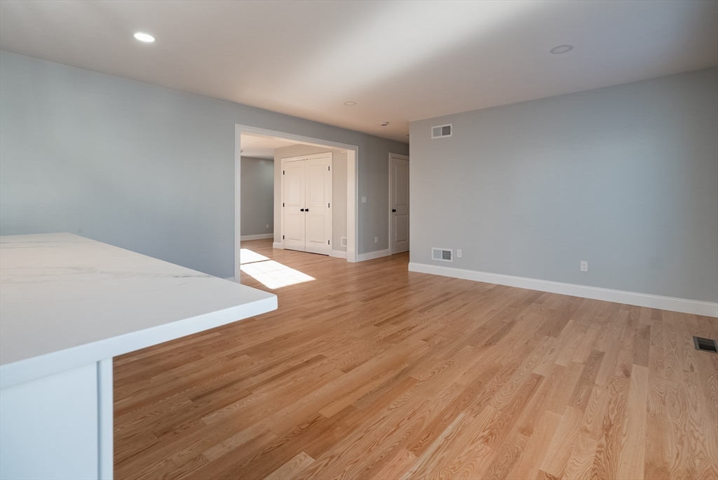 126 Wheeler Street Fall River, MA 02724 - Photo 8 of 29 a view of an empty room with wooden floor