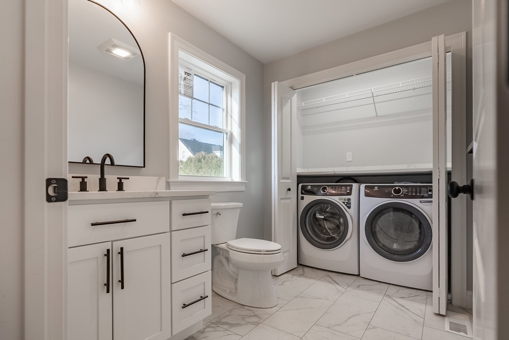 126 Wheeler Street Fall River, MA 02724 - Photo 9 of 29 a utility room with sink dryer and washer