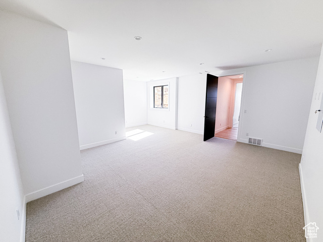 2132 East Outlaw Road, Unit 49 Kamas, UT 84036 - Photo 32 of 44 Unfurnished room featuring light carpet and baseboards