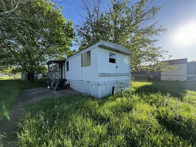a house with trees in the background
