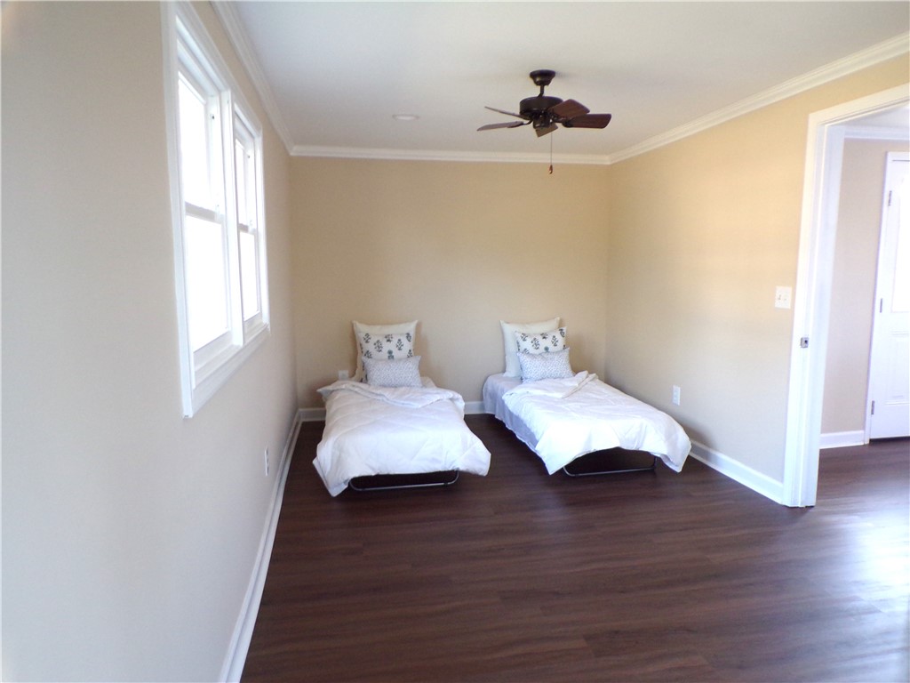 204 Old Salem Road Seneca, SC 29672 - Photo 17 of 28 Bright and airy room with rich flooring and classic trim details.