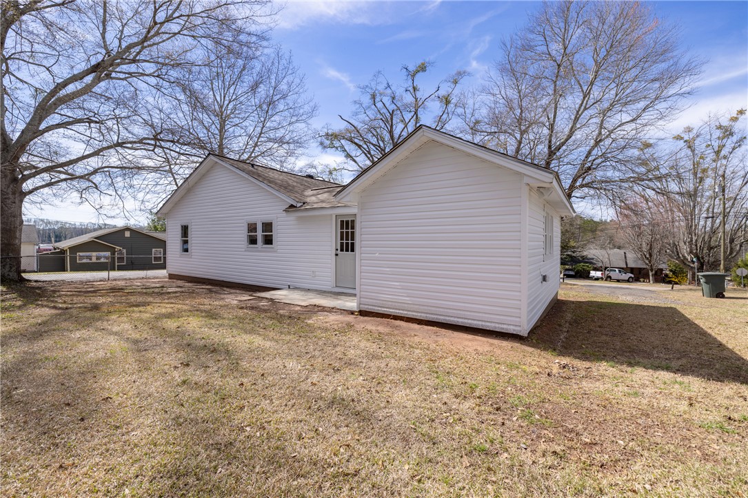 204 Old Salem Road Seneca, SC 29672 - Photo 22 of 28 This classic white home with a simple design offers comfortable living with a spacious yard.