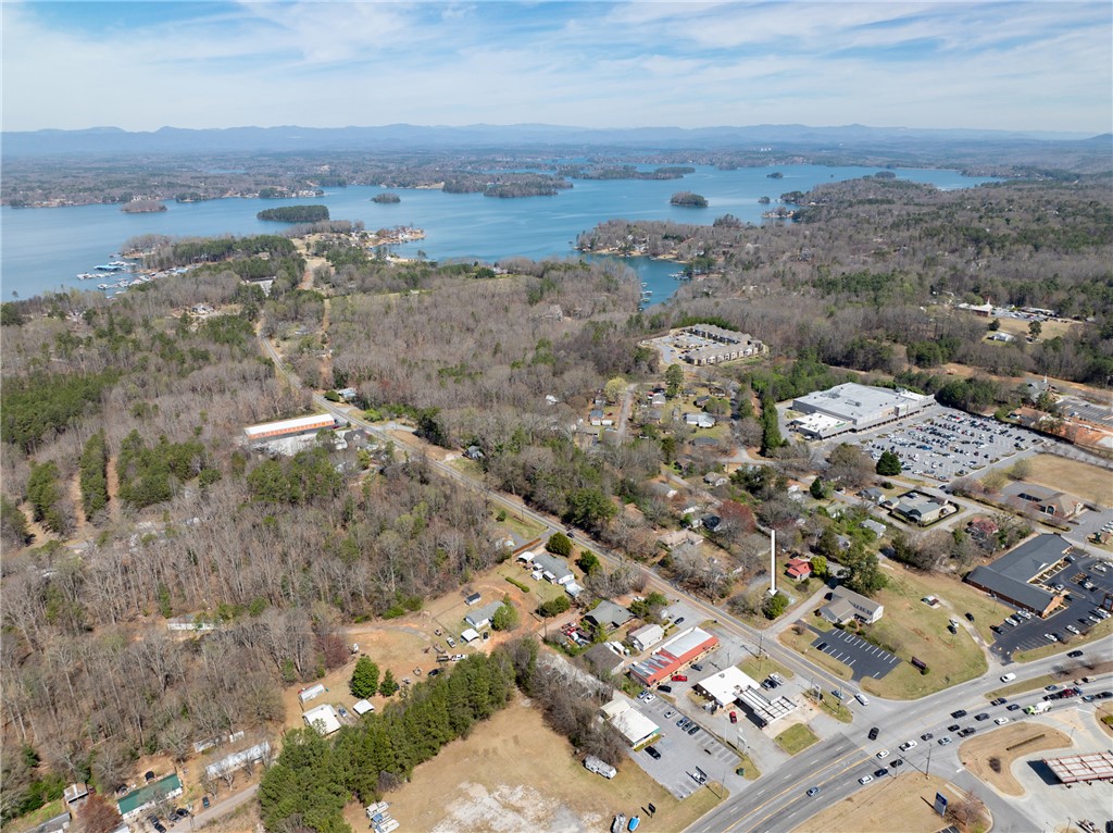 204 Old Salem Road Seneca, SC 29672 - Photo 28 of 28 Scenic aerial view reveals a vibrant community nestled by a expansive lake with distant mountains.