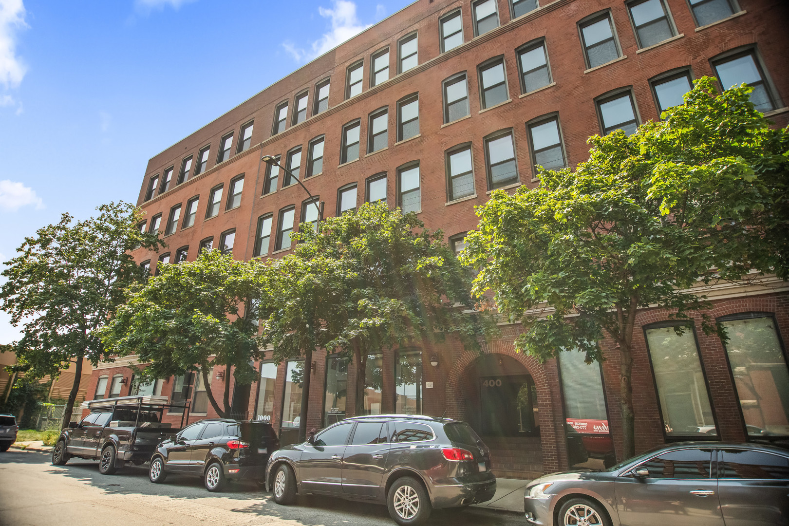 a view of a cars parked in front of a building