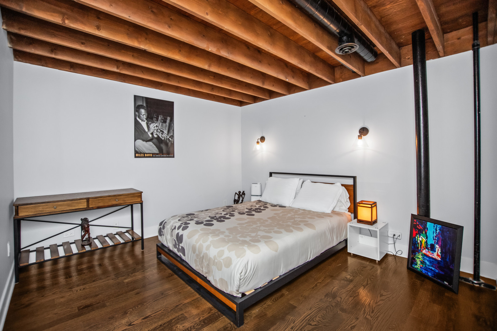 400 South Green Street, Unit 508 Chicago, IL 60607 - Photo 14 of 24 a bedroom with a bed a dresser and a book shelf