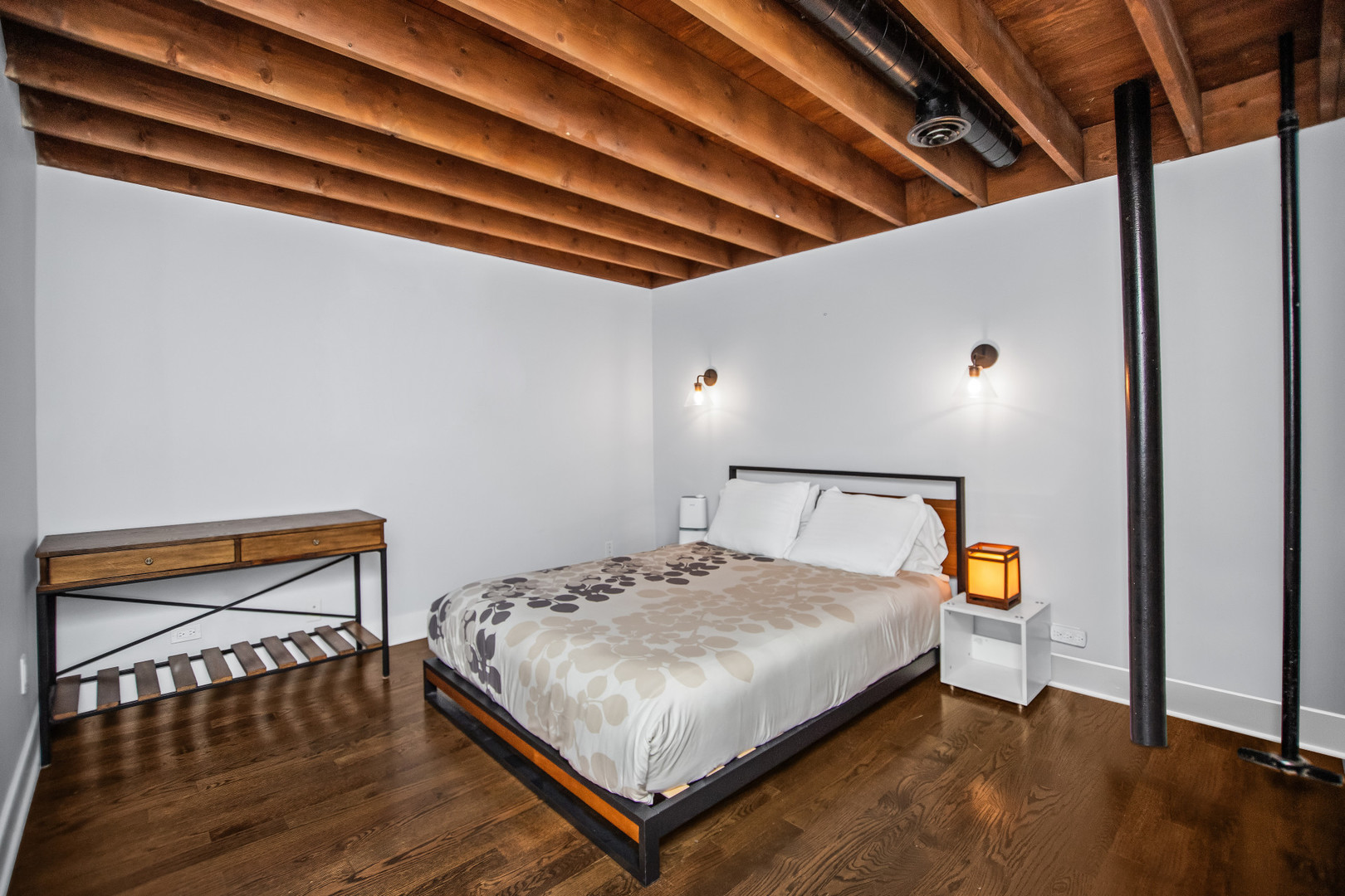 400 South Green Street, Unit 508 Chicago, IL 60607 - Photo 19 of 24 a bedroom with a bed and a book shelf