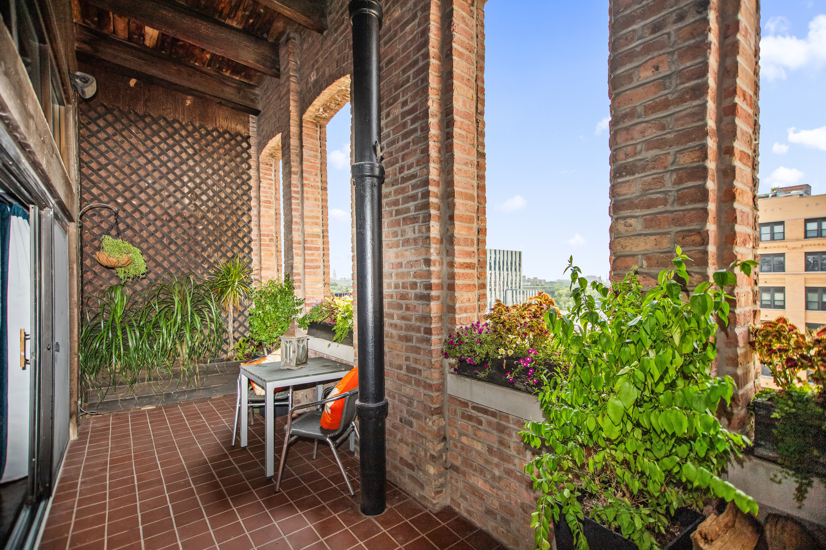 400 South Green Street, Unit 508 Chicago, IL 60607 - Photo 21 of 24 a view of a patio with a table and chairs and potted plants