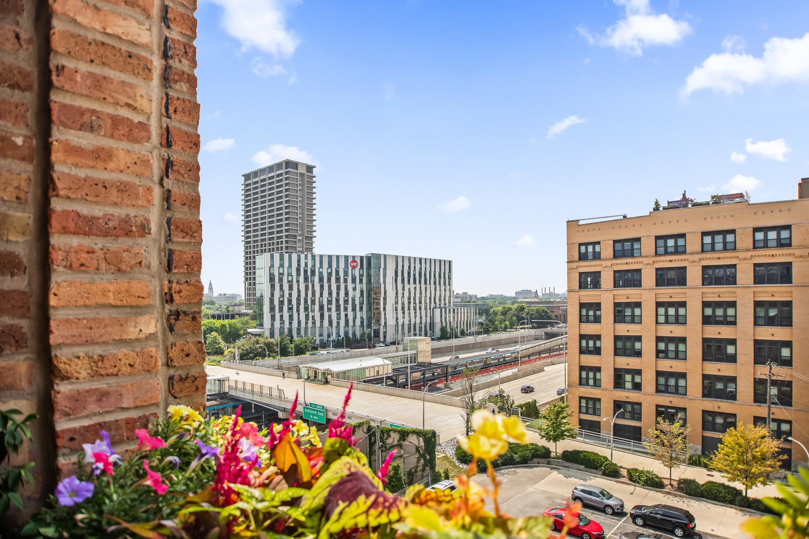 400 South Green Street, Unit 508 Chicago, IL 60607 - Photo 3 of 24 a view of a balcony with wooden floor and iron fence