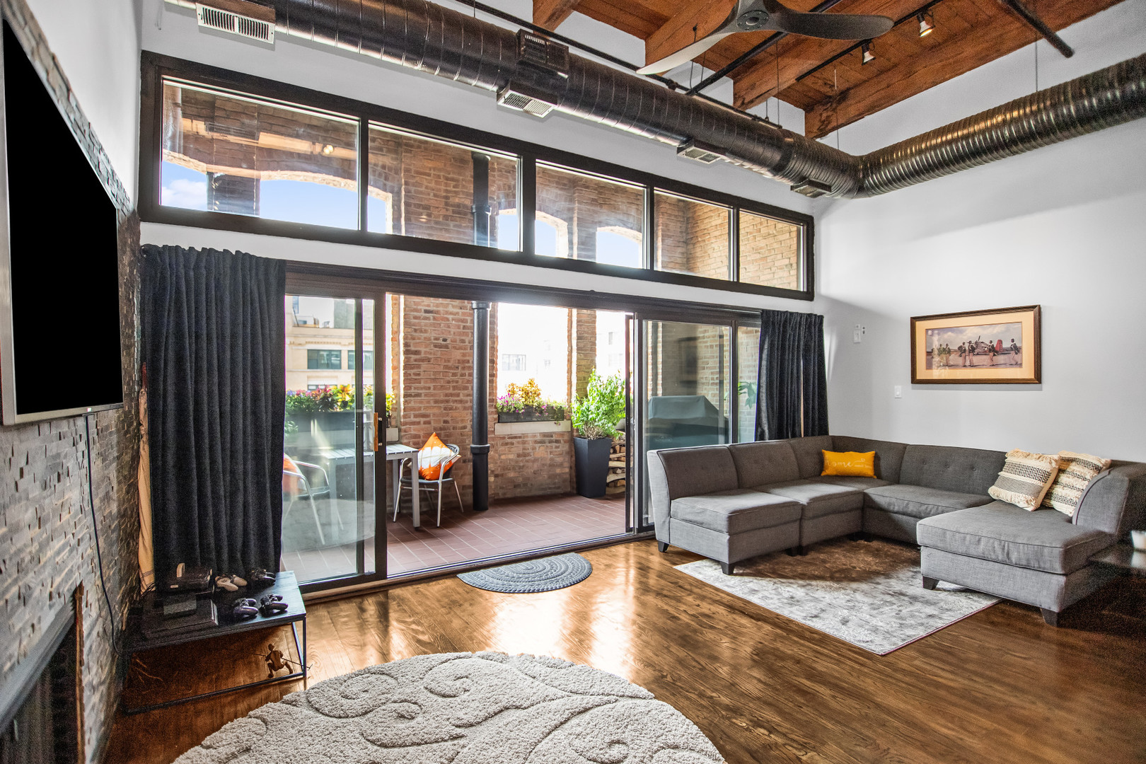 400 South Green Street, Unit 508 Chicago, IL 60607 - Photo 5 of 24 a living room with furniture and floor to ceiling windows