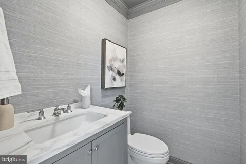 a kitchen with cabinets and a stove top oven