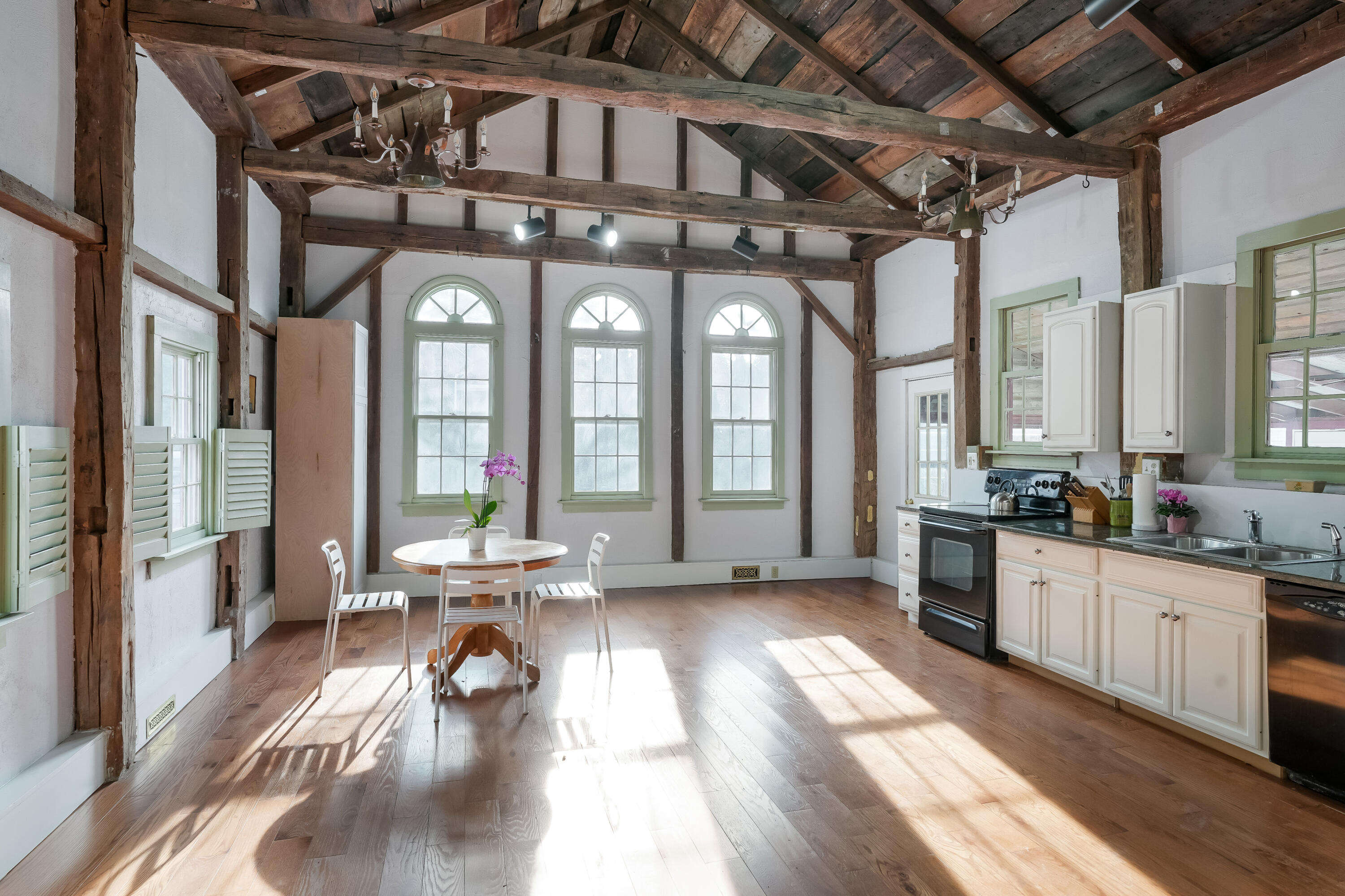 32 Norton Orchard Road Edgartown, MA 02539 - Photo 5 of 26 a view of a large room with wooden floor and furniture