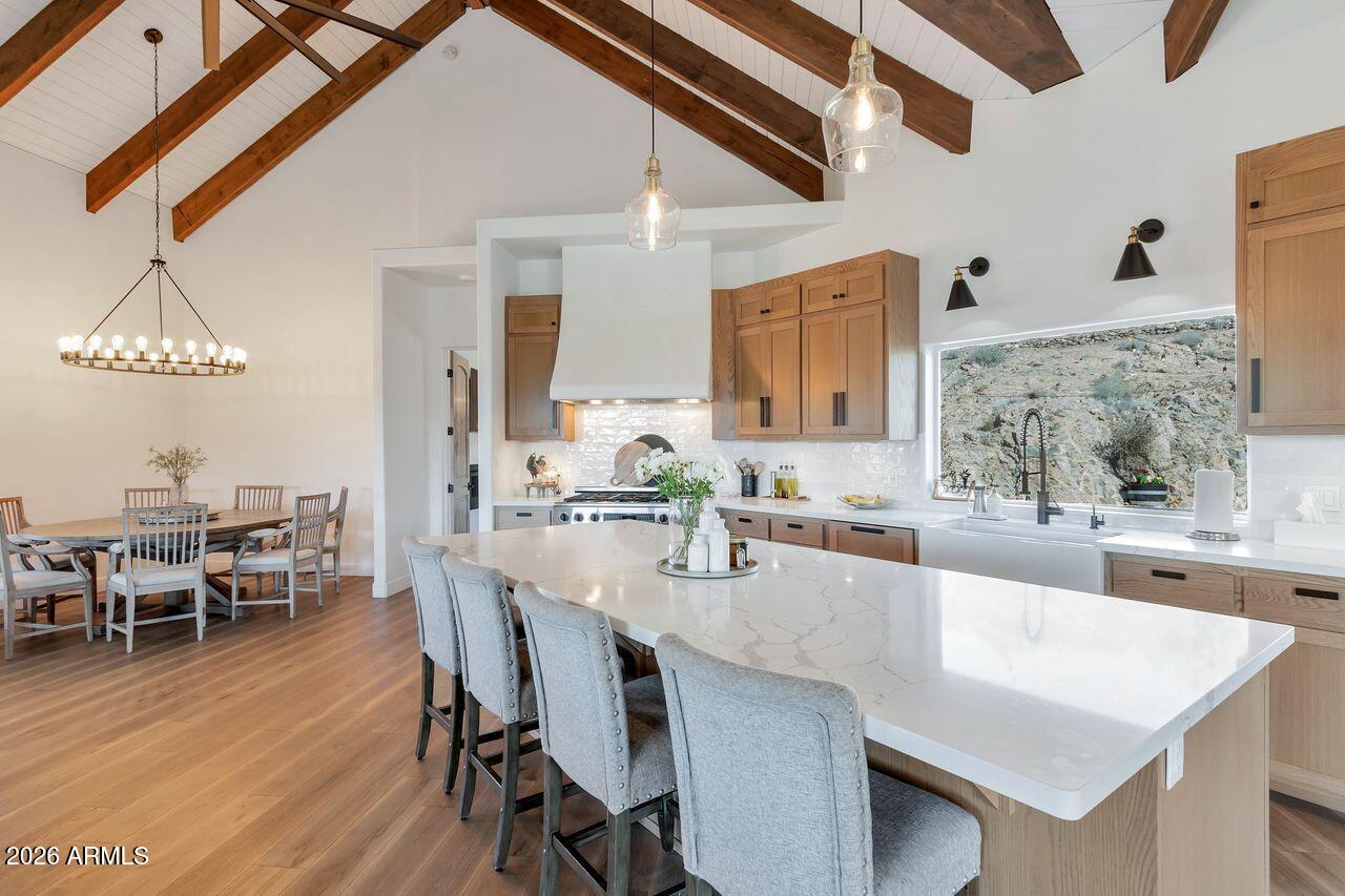1605 North Page Springs Road Cornville, AZ 86325 - Photo 11 of 51 a large kitchen with kitchen island a dining table and chairs