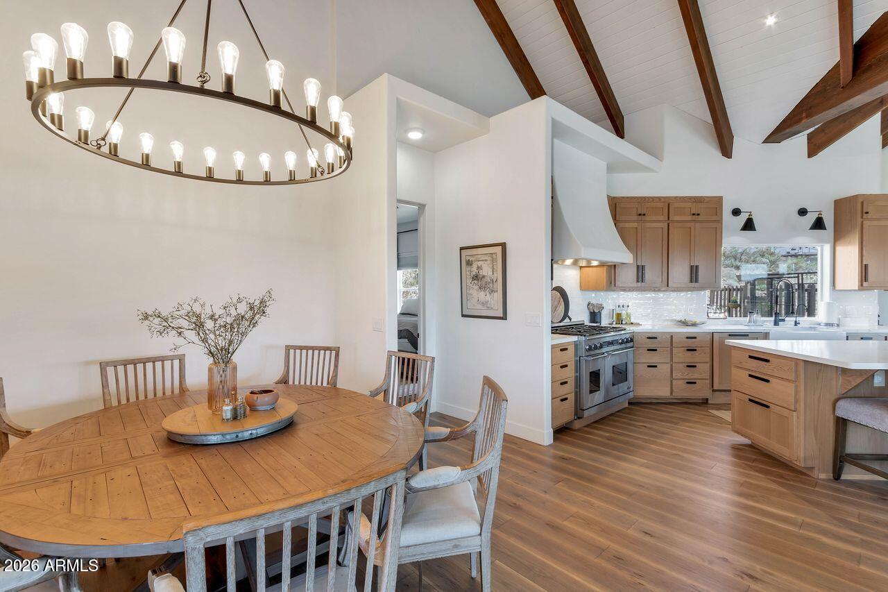 1605 North Page Springs Road Cornville, AZ 86325 - Photo 12 of 51 a kitchen with stainless steel appliances granite countertop a kitchen island a stove a table and chairs
