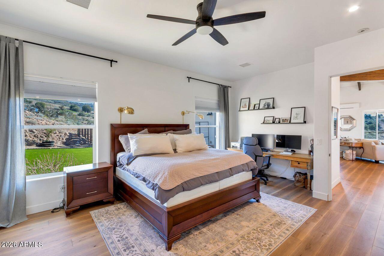 1605 North Page Springs Road Cornville, AZ 86325 - Photo 14 of 51 a bed room with a bed and a fireplace