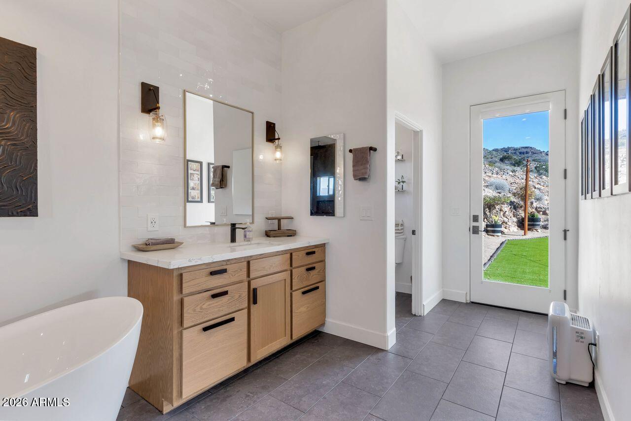 1605 North Page Springs Road Cornville, AZ 86325 - Photo 18 of 51 a spacious bathroom with a double vanity sink and a mirror