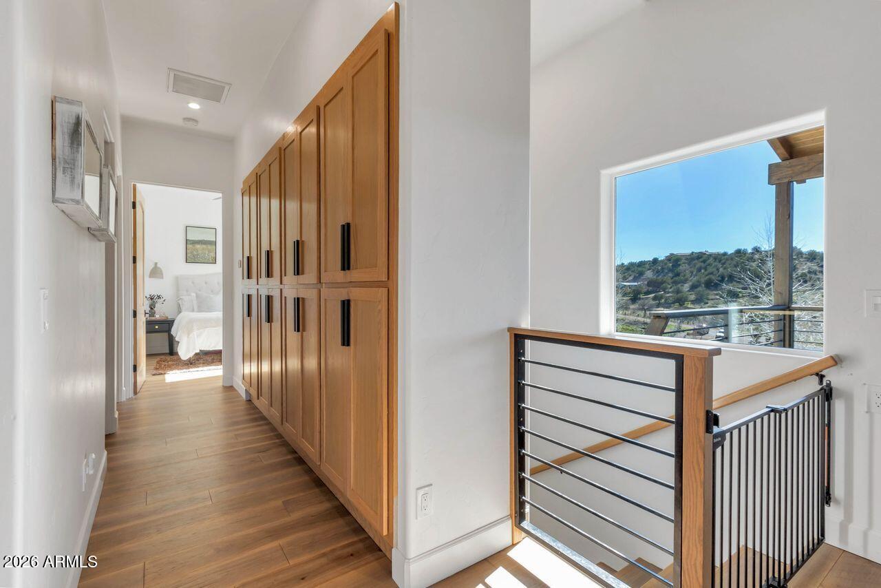 1605 North Page Springs Road Cornville, AZ 86325 - Photo 21 of 51 a view of a hallway with wooden floor and windows