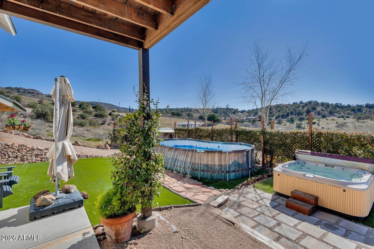 1605 North Page Springs Road Cornville, AZ 86325 - Photo 40 of 51 a view of a chairs and table in backyard