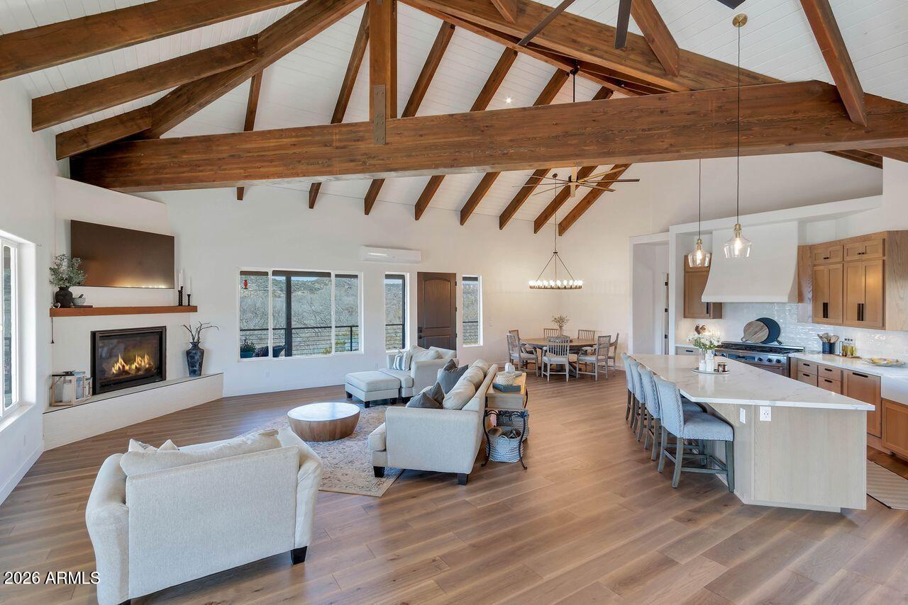 1605 North Page Springs Road Cornville, AZ 86325 - Photo 5 of 51 a living room with fireplace furniture and a wooden floor
