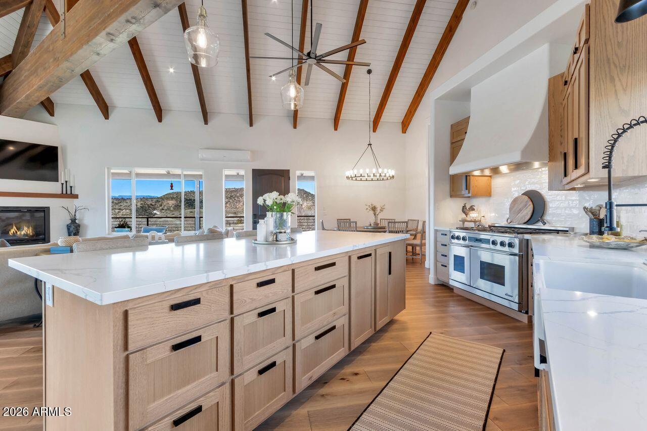 1605 North Page Springs Road Cornville, AZ 86325 - Photo 8 of 51 a kitchen with stainless steel appliances granite countertop a sink and a stove