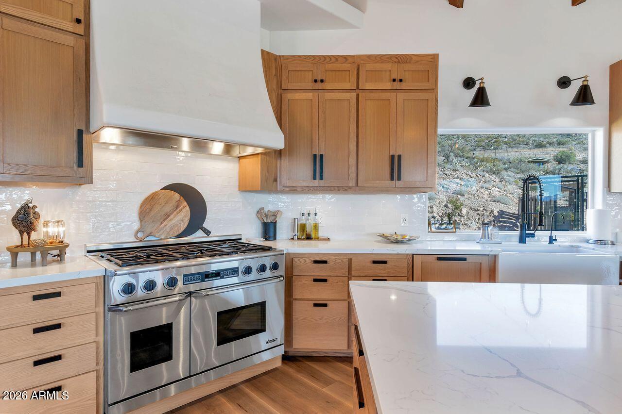 1605 North Page Springs Road Cornville, AZ 86325 - Photo 10 of 51 a kitchen with stainless steel appliances a stove a sink and a refrigerator