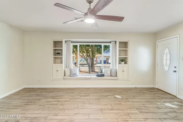 a view of an empty room with a window