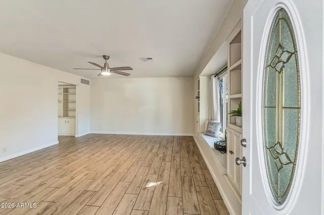 a living room with furniture and a potted plant