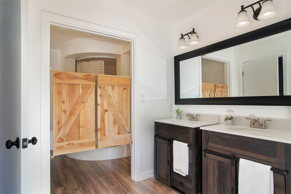 1939 Alga Road, Unit D Carlsbad, CA 92009 - Photo 13 of 25 The master bathroom offers two new vanities and a large shower.
