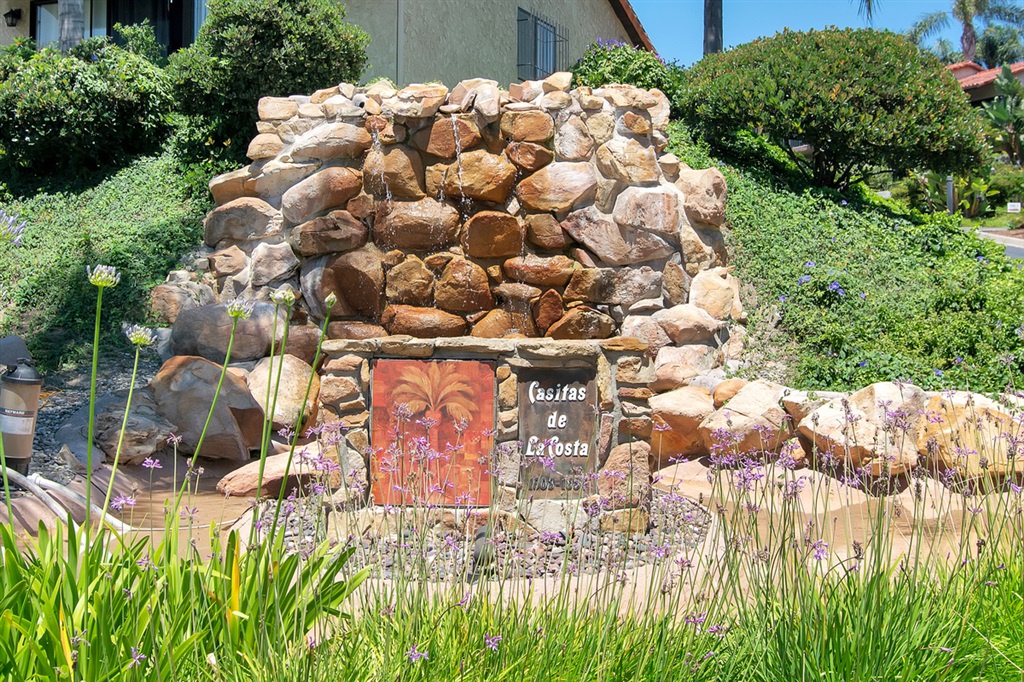 1939 Alga Road, Unit D Carlsbad, CA 92009 - Photo 25 of 25 Community of Casitas de La Costa signage with water feature.