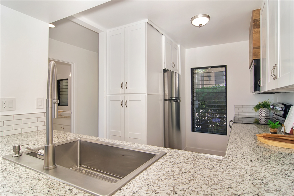 1939 Alga Road, Unit D Carlsbad, CA 92009 - Photo 4 of 25 All new kitchen with granite countertops, cabinets and self closing drawers, stianless steel sink and new appliances.