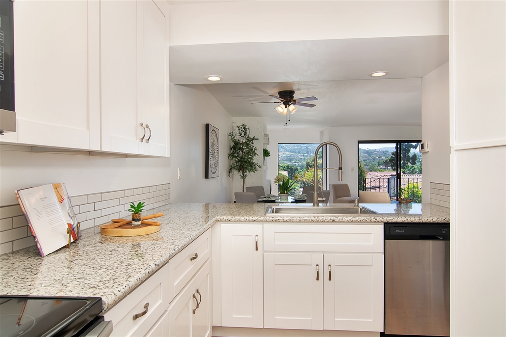 1939 Alga Road, Unit D Carlsbad, CA 92009 - Photo 5 of 25 A view of the kitchen toward the dining area.